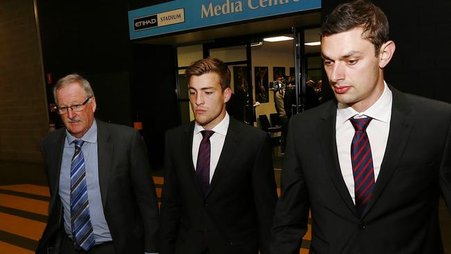 Viney leaves the tribunal flanked by player advocate Iain Findlay and teammate Alex Geogiou. Picture: Michael Klein