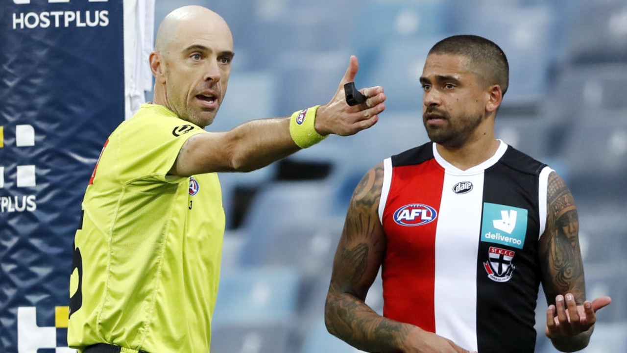 GEELONG, AUSTRALIA - AUGUST 14: Bradley Hill of the Saints is seen with AFL Field Umpire, Mathew Nicholls during the 2021 AFL Round 22 match between the Geelong Cats and the St Kilda Saints at GMHBA Stadium on August 14, 2021 in Geelong, Australia. (Photo by Dylan Burns/AFL Photos via Getty Images)