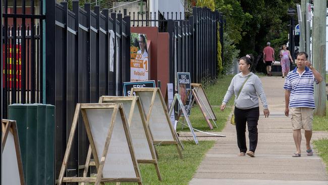 A couple come to vote on polling day at the Pine Rivers State High School, Saturday March 20, 2020. The normally busy booth is quiet because of the Covid-19 outbreak. (AAP/Image Sarah Marshall)