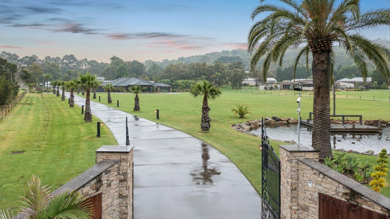 Buyers can drive dow the grand tree-lined driveway that sets the tone for the Lysterfield mansion.