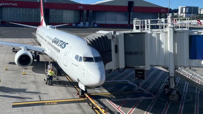 A female Qantas worker has been rushed to hospital with head injuries after falling about 5m at Sydney Airport. Picture: NewsWire / Dylan Coker