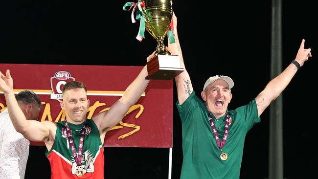 South Cairns Cutters captain Beau McKeown and coach Daryn Cresswell lift the premiership trophy after winning the AFL Cairns men's premiership. Cresswell is now the coach at Corowa Rutherglen. Picture: Brendan Radke