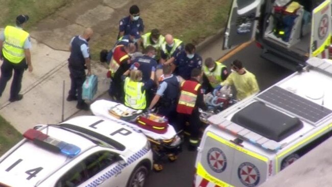 Adam Ghoz being treated at the scene of the crash. He later died in hospital. Picture: 7News