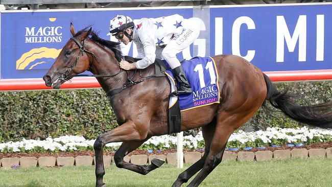 Jockey Luke Currie rides Sunlight to victory in Race 8, the Magic Millions Two-Years-Old Classic, during the Gold Coast Magic Millions at Aquis Park, Gold Coast Turf Club, Queensland, Saturday, January 13, 2018. Picture: Jono Searle.