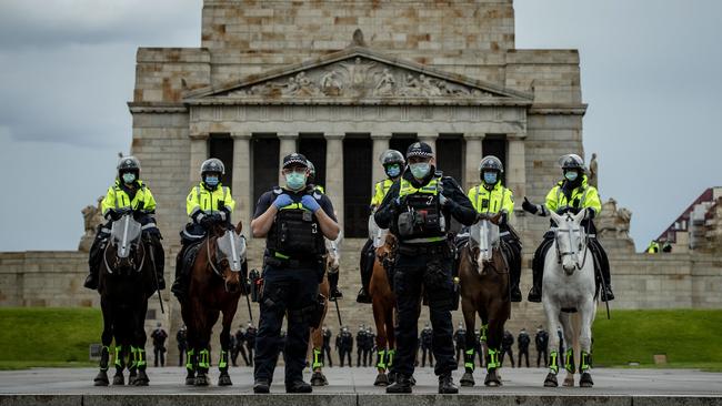 Police officers patrol the Shrine of Remembrance during an anti-lockdown rally on September 12. Picture: Getty