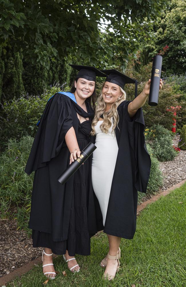 Celebrating their Bachelor of Science graduation are friends Danika Richardson (left) and Kirra Johnson at a UniSQ graduation ceremony at Empire Theatres, Tuesday, February 13, 2024. Picture: Kevin Farmer