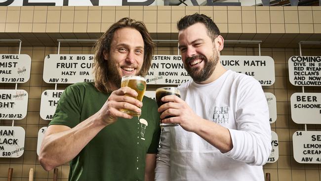 Jake Phoenix and Alex Marschall serving up beers at the new Bowden Brewing at Plant 3 in Bowden. Picture: Matt Loxton.