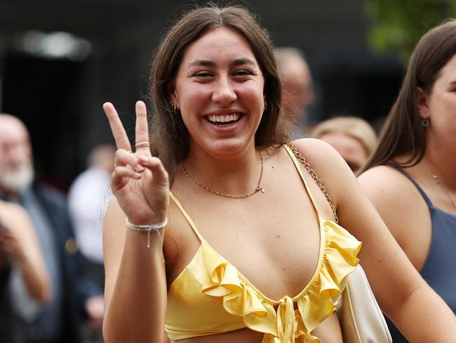 Racegoers arrive and show their enthusiasm prior to Sydney Racing