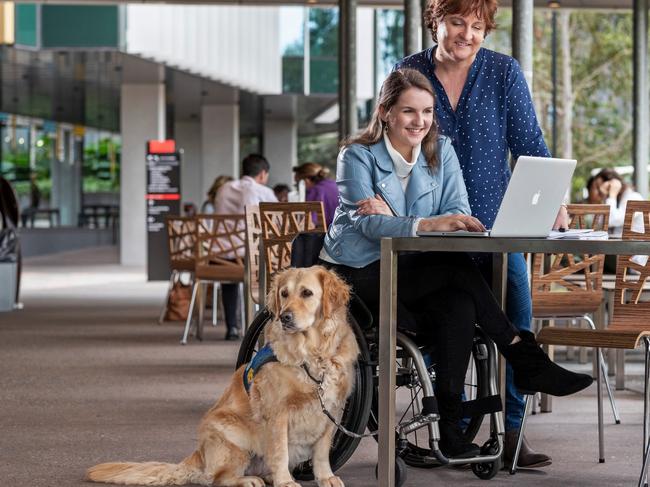 Erin Condrin, her mum Kerri, and Lacey from Canine Helpers. Photo: Supplied