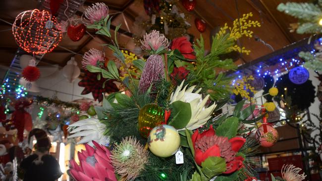 An ‘Australiana’ style Christmas tree decorated with native flowers and glass ornaments.