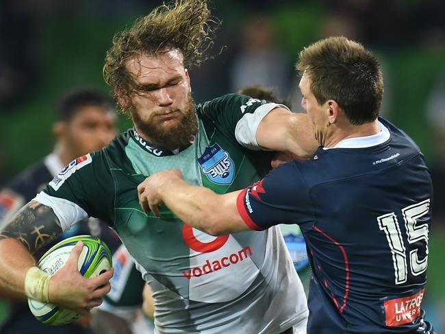 Warrick Gelant of the Bulls (left) fends off Rebels fullback Dane Haylett-Petty on Friday night. Picture: AAP