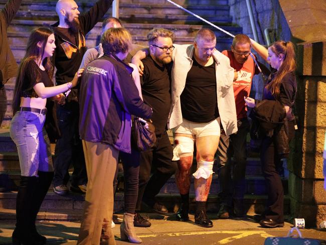 Police and other emergency services are seen near the Manchester Arena after reports of an explosion Picture: Joel Goodman/LNP