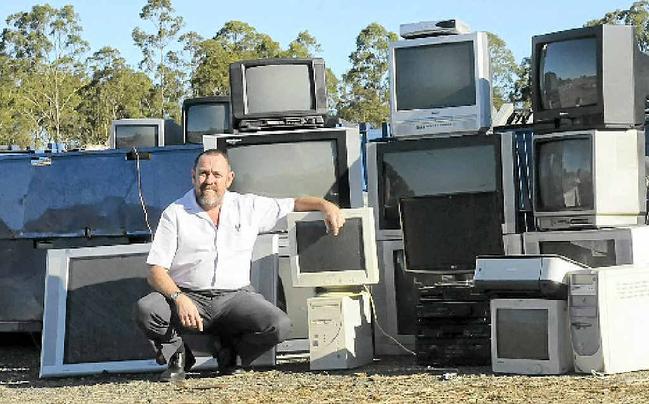 E-WASTE: Peter Cotterill (above), Manager Environment, Health and Regulatory Control for Richmond Valley Council with discarded electronics at Casino waste and recycle facility and, at right, Northern Rivers Waste Operations Supervisor Charlie Crethar with one of the television sets collected at the E-Waste facility. Picture: Doug Eaton And Cathy Adams