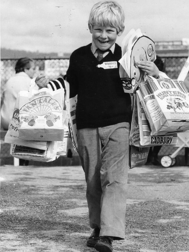 1970 — Jeffrey Brooks, 7, of Unley, happy with a large collection of bags.