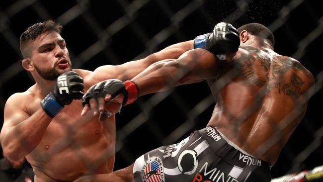 Kelvin Gastelum (L) grew up living meal to meal and working all types of jobs to put food on the table for his mother and sister. (Photo by Steve Marcus/Getty Images)