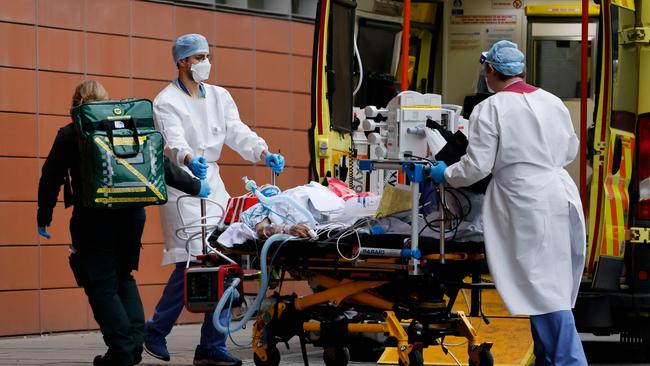 Medics take a patient from an ambulance into the Royal London hospital, in London. Picture: AFP