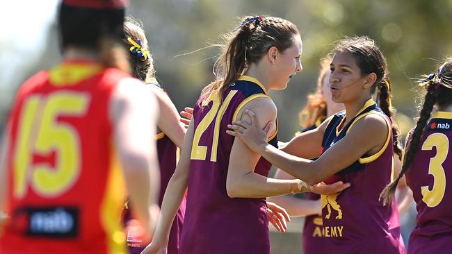 Ameilia Leigh of the Lions celebrates with team mates after kicking a goal during the AFL U16 Girls match between the Brisbane Lions and the Gold Coast Suns. (Photo by Albert Perez/AFL Photos via Getty Images)