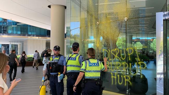 Protesters have again targeted the Woodside building in Perth to draw attention to the Burrup Hub development.