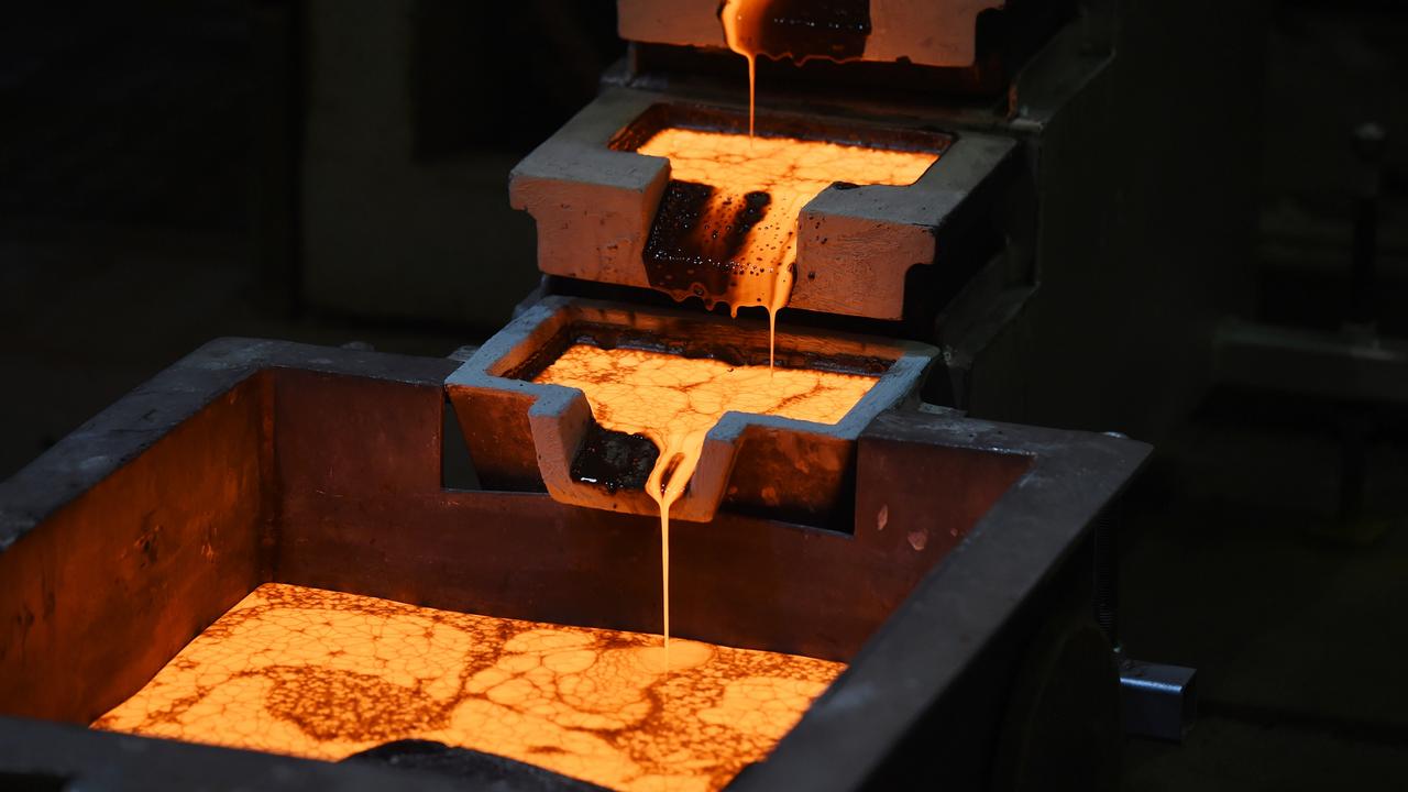 Molten gold is poured into moulds at Kalgoorlie, Western Australia. Picture: Carla Gottgens