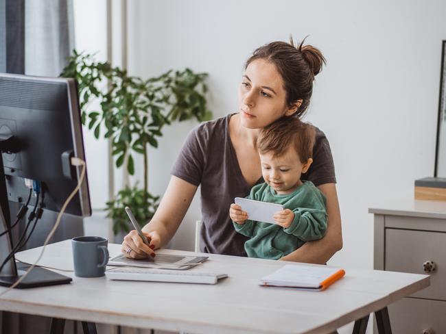 CHILD TECHNOLOGY -  Women working from home and playing with baby boy during pandemic isolation Picture: Istock