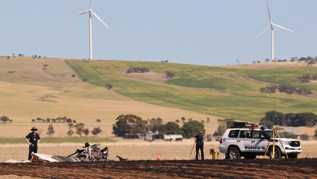 Police at the scene of the plane crash that claimed the lives of Ben and Charlie Mumford at Redhill. Picture: Russell Millard Photography