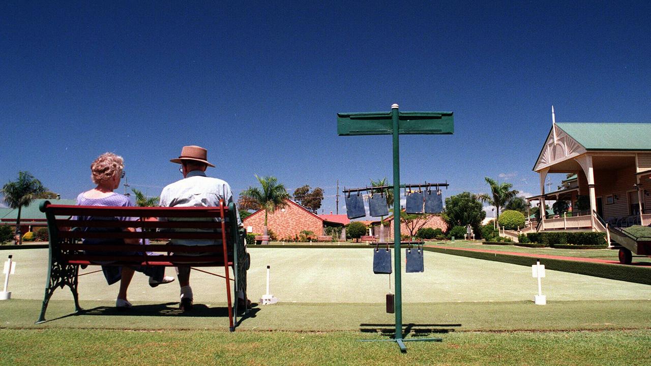 Retirees Leila Stock and Mal Jones sitting on a bench at Cleveland Gardens Retirement Village Qld. / Housing / Aged couple man woman retirement generic