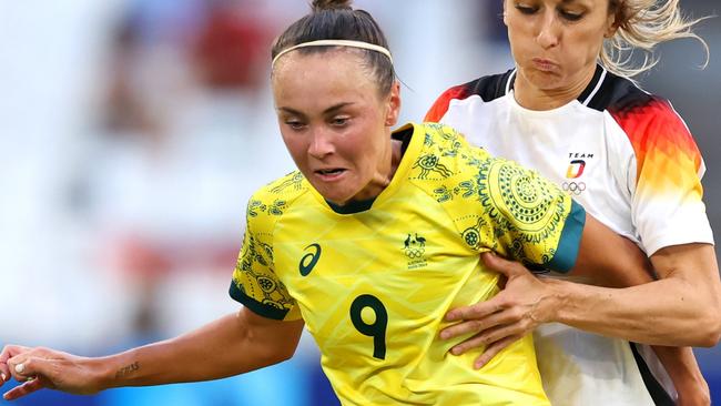 MARSEILLE, FRANCE - JULY 25: Caitlin Foord #9 of Team Australia is challenged by Kathrin Hendrich #3 of Team Germany during the Women's group B match between Germany v Australia during the Olympic Games Paris 2024 at Stade de Marseille on July 25, 2024 in Marseille, France. (Photo by Alex Livesey/Getty Images)