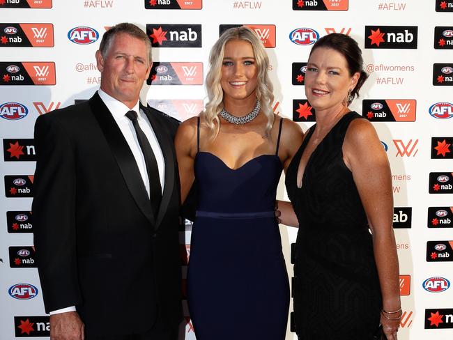 Tayla Harris with her parents, Lisa and Warren. Picture: Michael Dodge