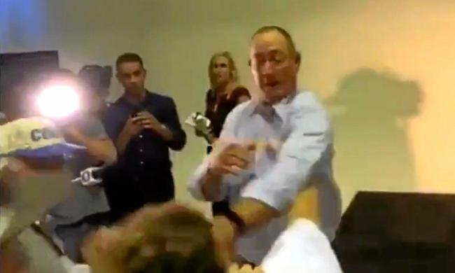 EGGING CONFRONTATION: A protester cracks an egg on Senator Fraser Anning's head during a press conference. Picture: Contributed