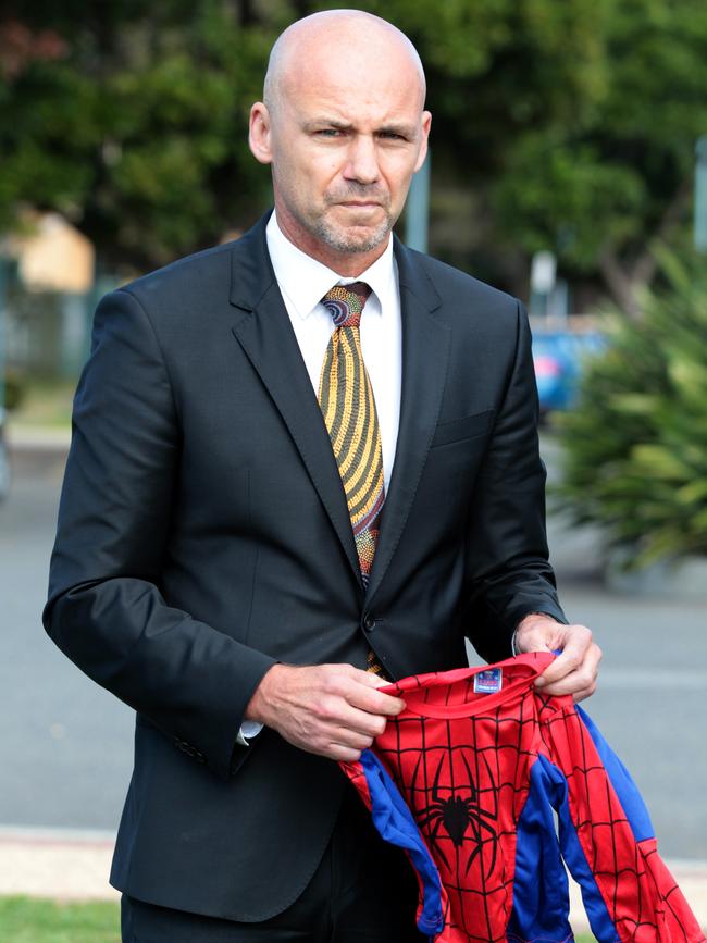 Detective Inspector Gary Jubelin appeals for information on the disappearance of William Tyrrell as he holds a Spider-Man suit like the one the youngster was wearing. Picture Nathan Edwards