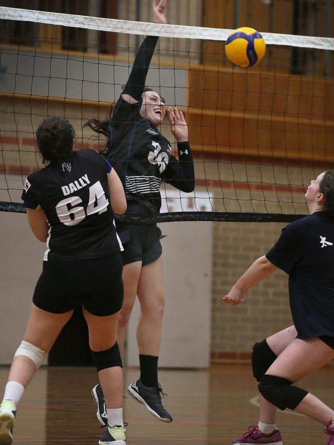 Harry Robinson-Cox identifies as a woman. Here she is in action playing volleyball for Adelaide University. Picture: Dean Martin