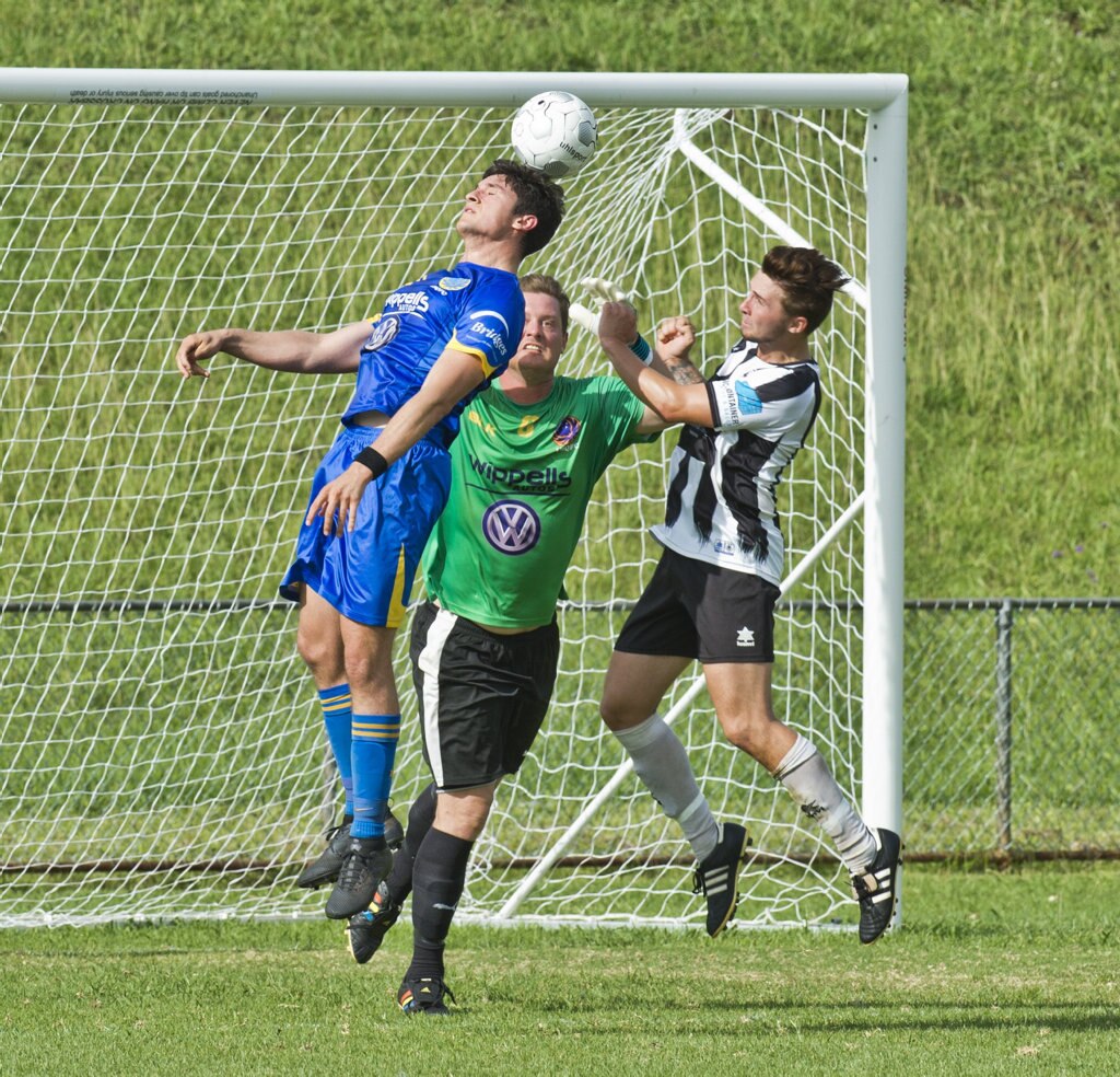 Alex Dyball, USQ and Matt Eilers, USQ and Nikolas Lawson, Willowburn. Football, Willowburn vs USQ. Sunday, 4th Mar, 2018. Picture: Nev Madsen