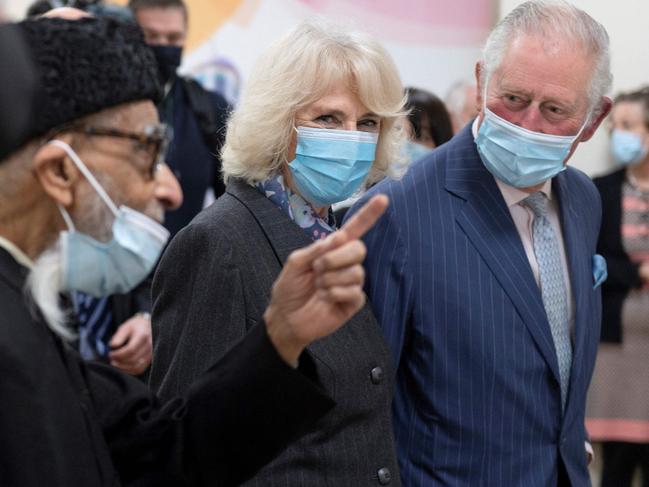 Britain's Prince Charles, Prince of Wales (R) and Britain's Camilla, Duchess of Cornwall, visit a temporary COVID-19 vaccination centre at a mosque in East London. Picture: AFP