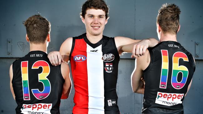 (from left) Jack Lonie, Blake Acres and Jack Newnes model the Saints’ Pride Game jumpers. Picture: Michael Klein
