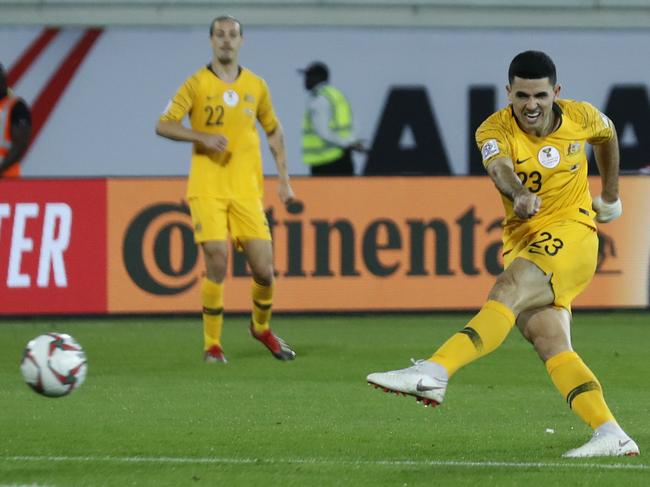 Australia's midfielder Tomas Rogic, right, kicks his goal ball, during the AFC Asian Cup group B soccer match between Australia and Syria at the Khalifa bin Zayed Stadium in Al Ain, United Arab Emirates, Tuesday, Jan. 15, 2019. (AP Photo/Hassan Ammar)