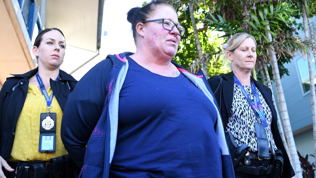 Shannon White (centre) is taken from the Morningside police station after she was arrested. Picture: AAP/Dan Peled