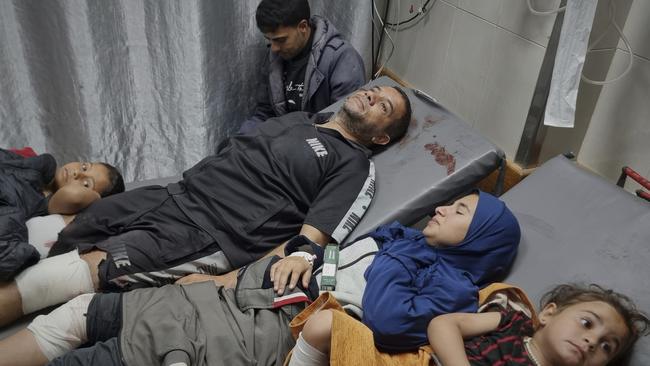 Injured Palestinians wait for treatment at the hospital following Israeli army air strikes in Khan Younis, southern Gaza Strip, on March 18. Picture: AP/ Mohammad Jahjouh