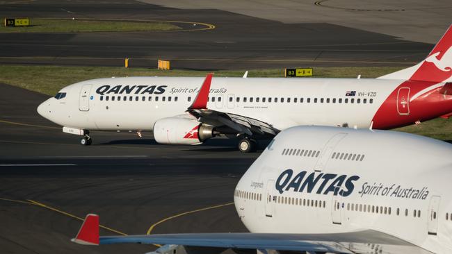 Two Boeing Commercial Aircraft at Sydney Kingsford Smith airport,  getting ready for take off