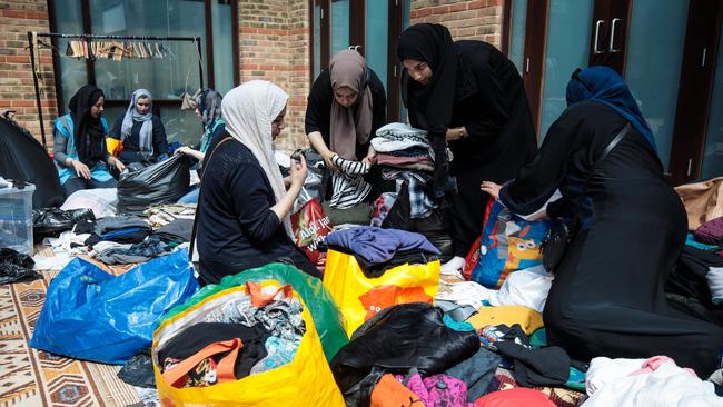 Volunteers sort through donations for victims at the Al Manaar Muslim Cultural Centre near Grenfell Tower. Picture: Jack Taylor/Getty Images