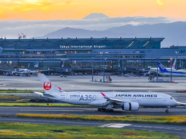 Japan - November 17, 2022 : A350  Aircraft of  Japan Airlines taxiing on the runway of Haneda International Airport with Fuji Mountain Backgourd at Sunset, TokyoPhoto  - istockEscape 15 Dec 2024