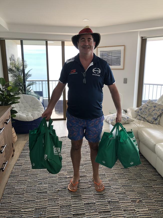 Gold Coast Turf Club chairman Brett Cook shows off his haul from the farmers markets.