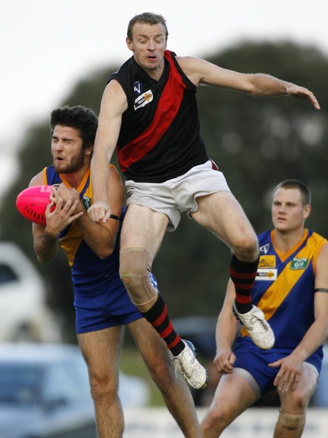 Boisdale-Briagolong president Ryan Evans, centre, during his playing days.