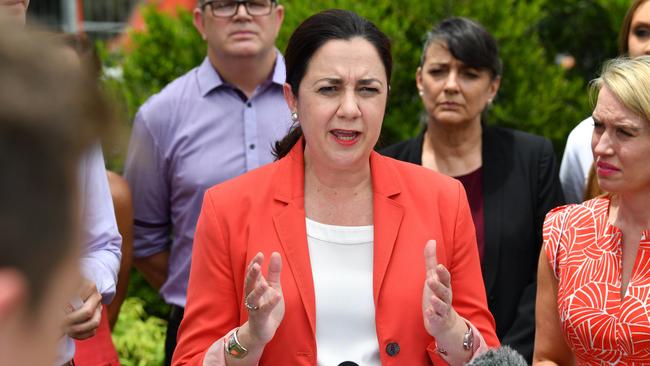 Queensland Premier Annastacia Palaszczuk (centre) is seen during a press conference at Oxenford on the Gold Coast during the Queensland Election campaign on Sunday, November 5, 2017. Premier Palaszczuk announced an M1 action plan to include upgrading the highway to six lanes the entire stretch from Brisbane to the border of New South Wales. (AAP Image/Darren England) NO ARCHIVING