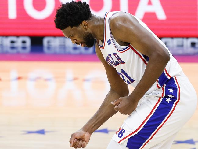 PHILADELPHIA, PENNSYLVANIA - JANUARY 06: Joel Embiid #21 of the Philadelphia 76ers celebrates during the fourth quarter against the Washington Wizards at Wells Fargo Center on January 06, 2021 in Philadelphia, Pennsylvania. NOTE TO USER: User expressly acknowledges and agrees that, by downloading and or using this photograph, User is consenting to the terms and conditions of the Getty Images License Agreement.   Tim Nwachukwu/Getty Images/AFP == FOR NEWSPAPERS, INTERNET, TELCOS & TELEVISION USE ONLY ==