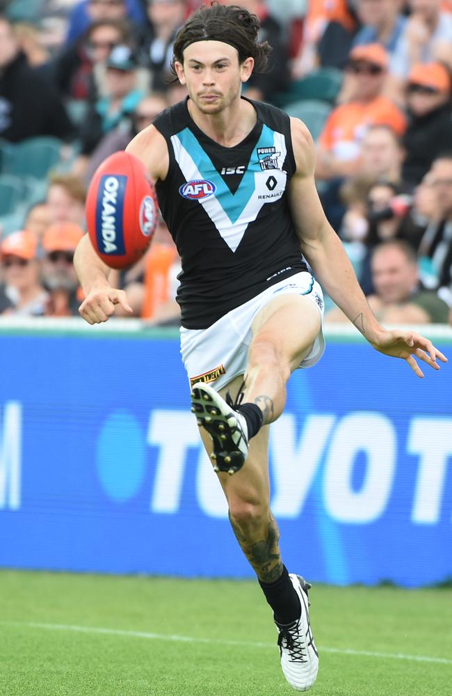 Pittard clears the ball at Manuka Oval in Canberra.