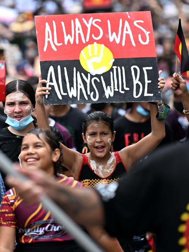 People take part in an Invasion Day protest in central Brisbane on Australia Day last year. Picture: NCA NewsWire / Dan Peled