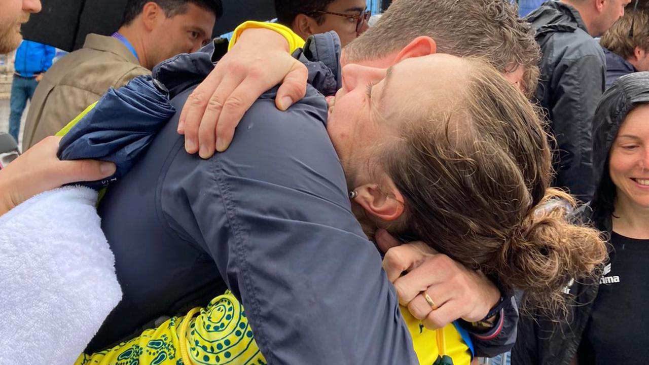 Australian cyclist Grace Brown embraces her husband Elliott Smith after winning the individual time trial at the 2024 Paris Olympics.