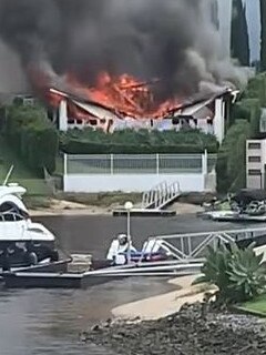 Video shows fire destroying the home’s roof and balcony.