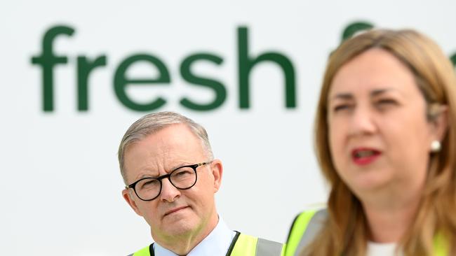 Anthony Albanese watches Annastacia Palaszczuk as she speaks during the official opening of Woolworths’ new distribution centre in Heathwood. Picture: NCA NewsWire / Dan Peled