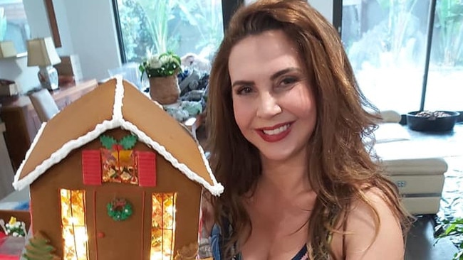 Stonnington mayor Melina Sehr with one of the gingerbead houses made by her business Wonder Ever After. Picture: Facebook